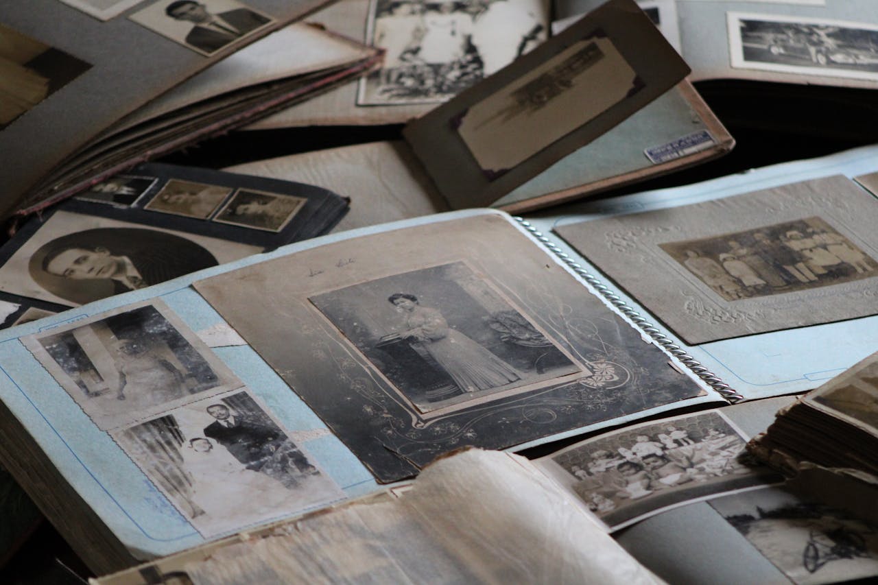Koti Explore vintage family photo albums filled with black and white photographs, capturing timeless memories.
